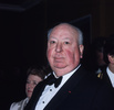 Alfred Hitchcock (1971) - Photograph of Alfred Hitchcock attending the Society of Film and Television Arts Awards ceremony (now known as the BAFTAs) in London in March 1971, taken by photographer Mike Lawn. His wife Alma is stood behind him.