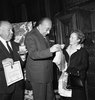 Alfred Hitchcock (1960) - Photograph of Julien Tardieu presenting Alfred Hitchcock with a silver medal for his work in the film industry, taken in Paris in October 1960.