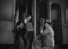 Strangers on a Train (1951) - film frame - Film frame from ''Strangers on a Train'' (1951) showing Hitchcock's cameo appearance.